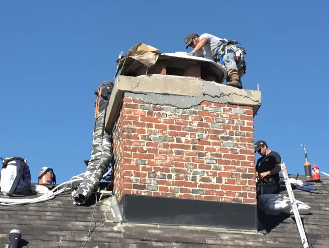 Carver Chimney Sweep installing a custom chimney crown in Carver, MA
