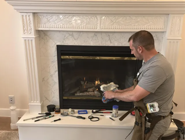 Carver Chimney Sweep performing fireplace maintenance in Carver, MA