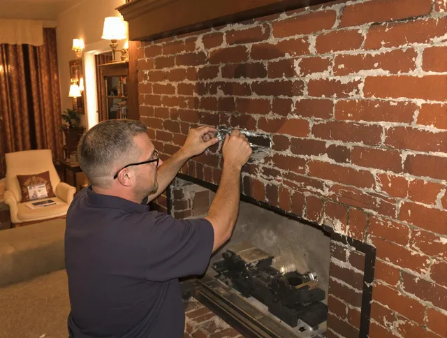 Carver Chimney Sweep expert fixing a fireplace in Carver, MA